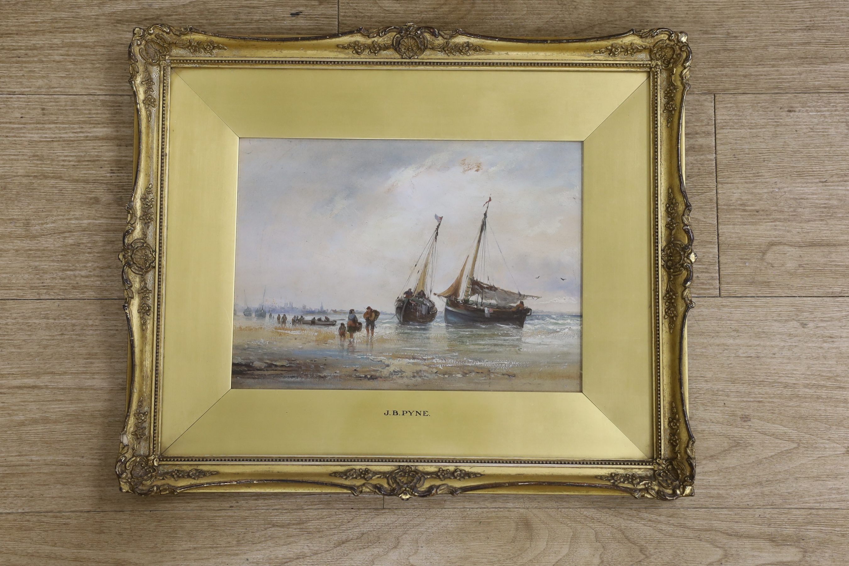 Attributed to James Baker Pyne (1800-1870), oil on board, Beached fishing boats and figures at low tide, unsigned, inscribed to the mount, 21 x 29cm, ornate gilt framed